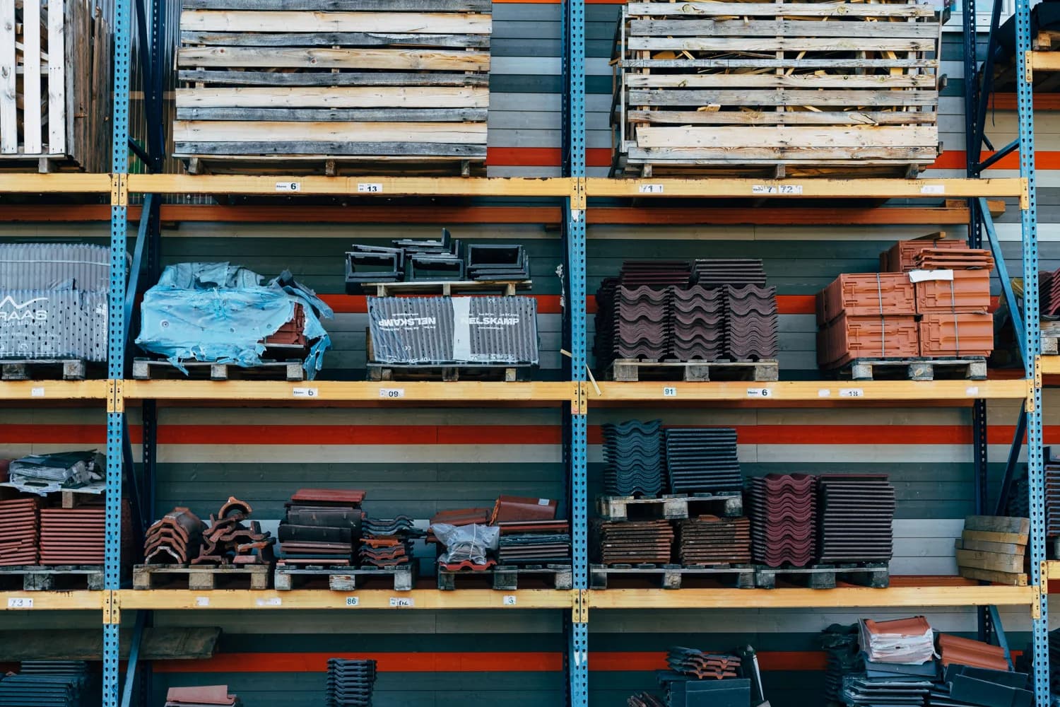 Rows of building supplies and roofing materials in a well-stocked hardware warehouse